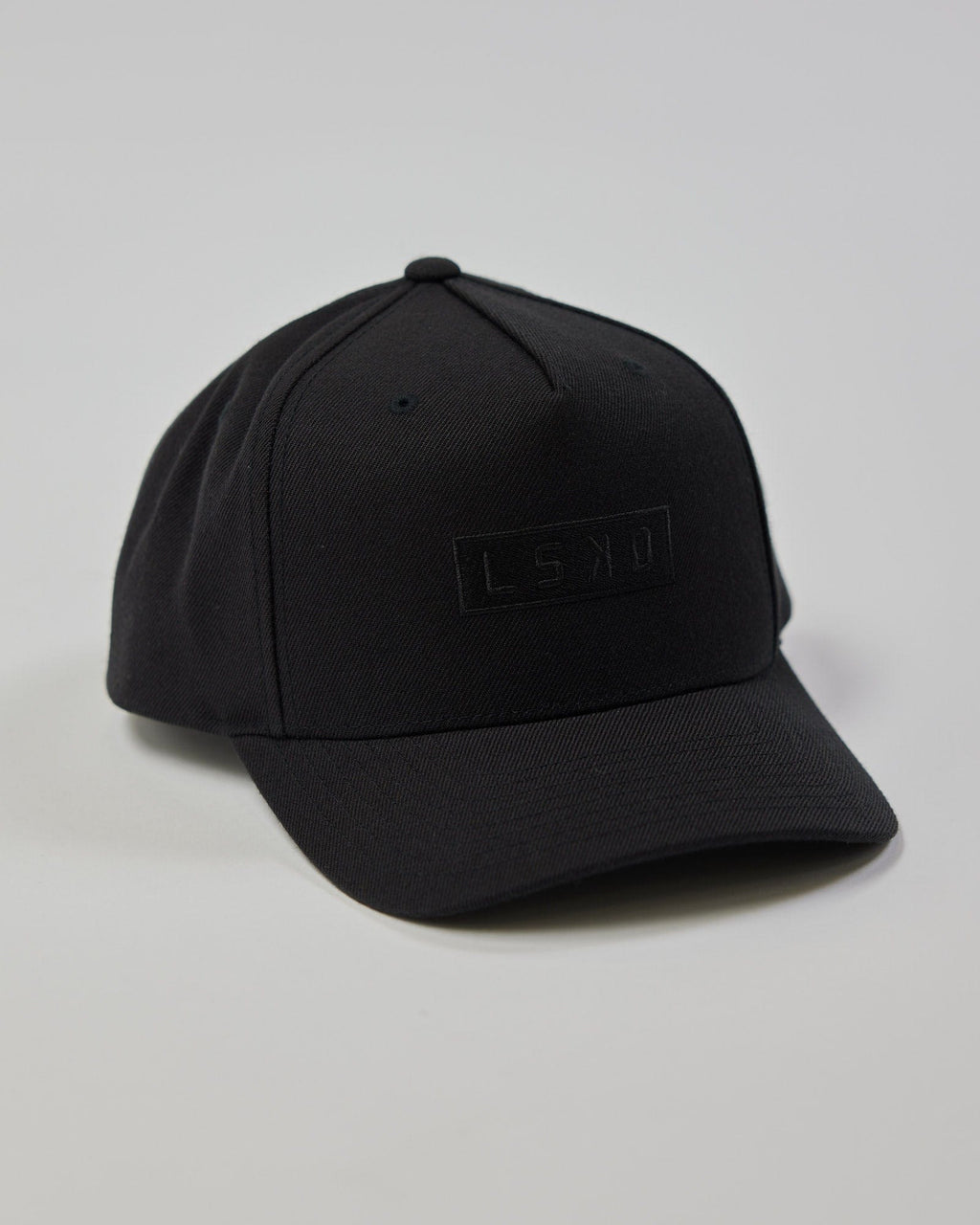 Model wearing Cornerstone Snapback Cap - Black-Black