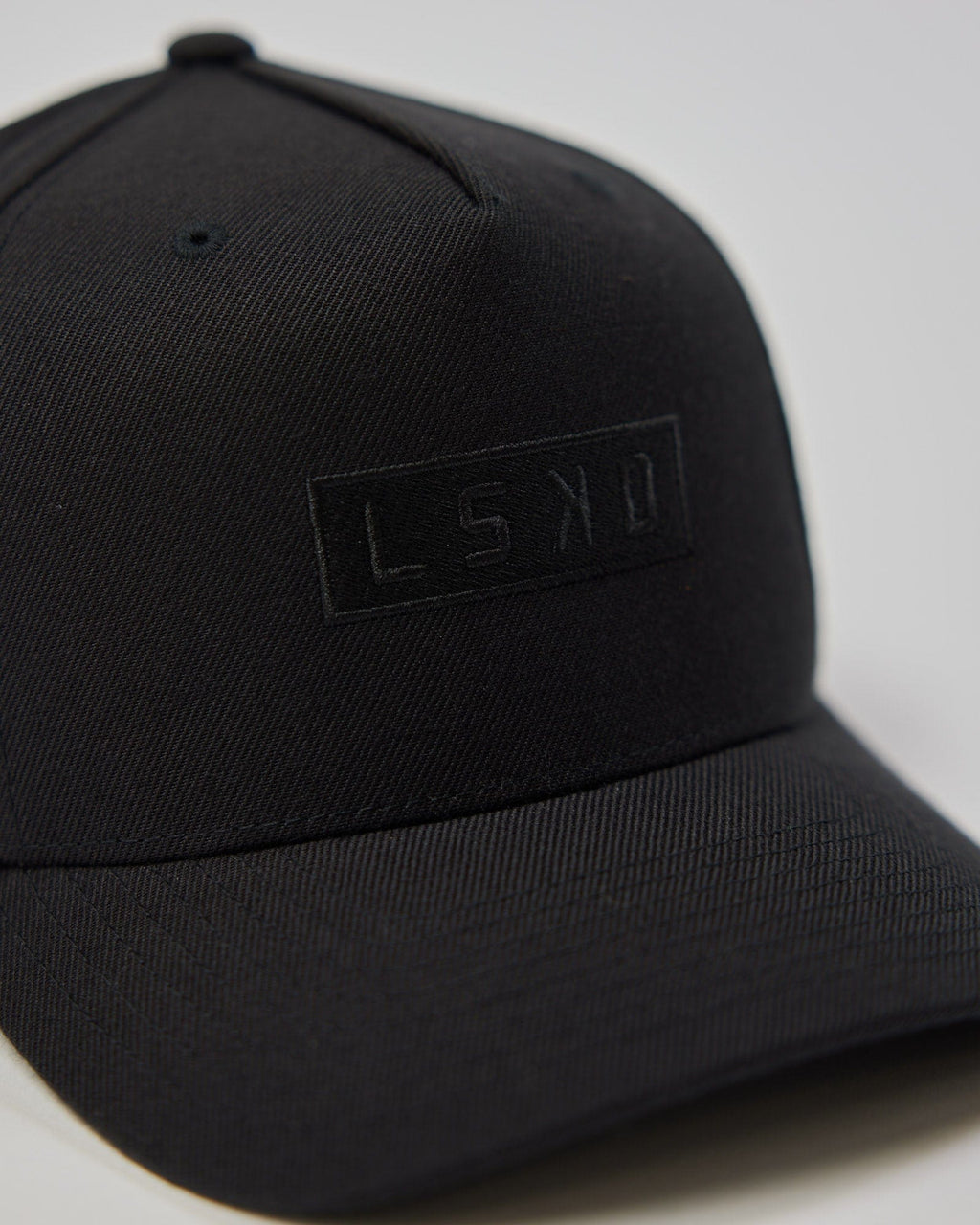 Model wearing Cornerstone Snapback Cap - Black-Black