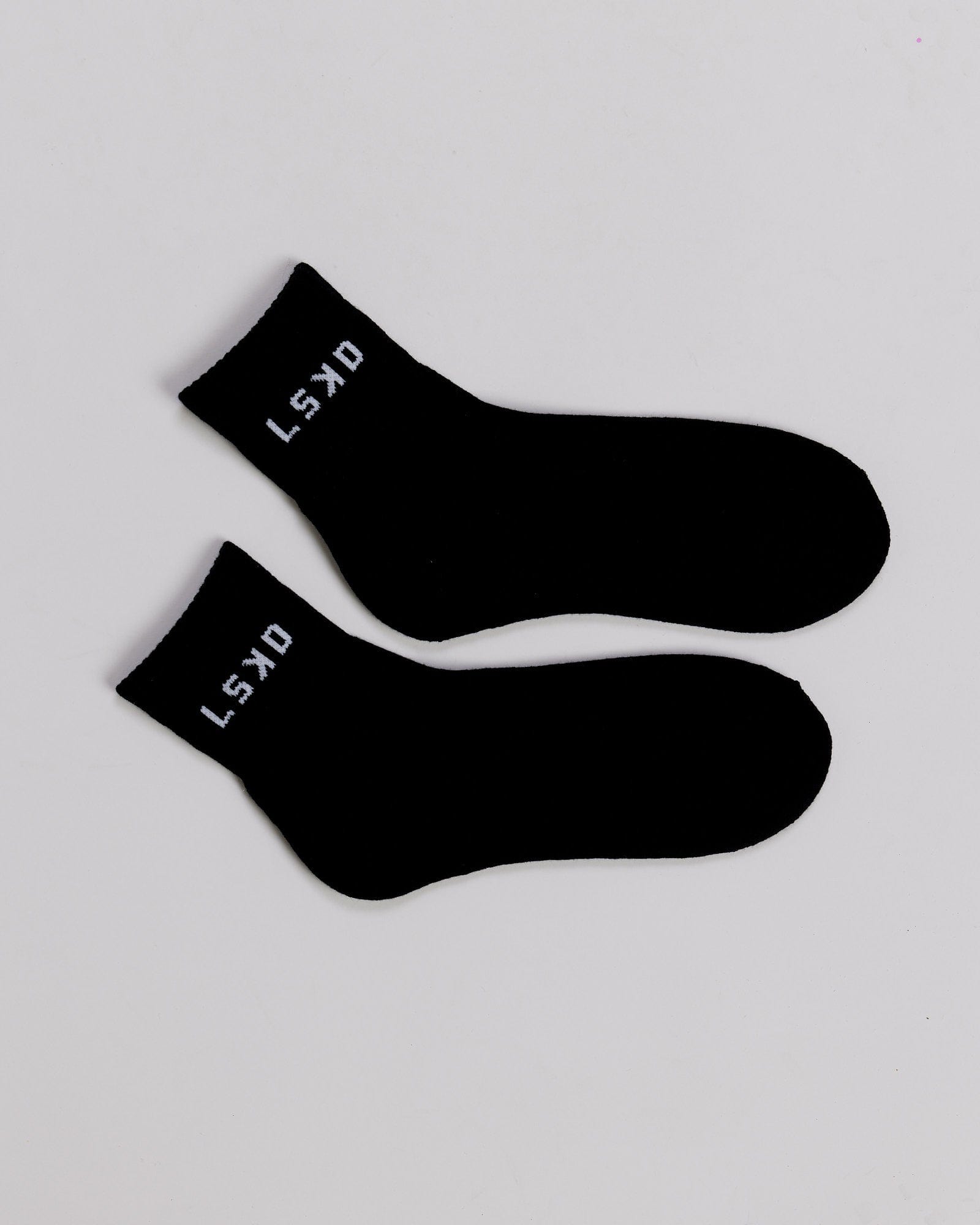Model wearing Daily Quarter Crew Sock - Black
