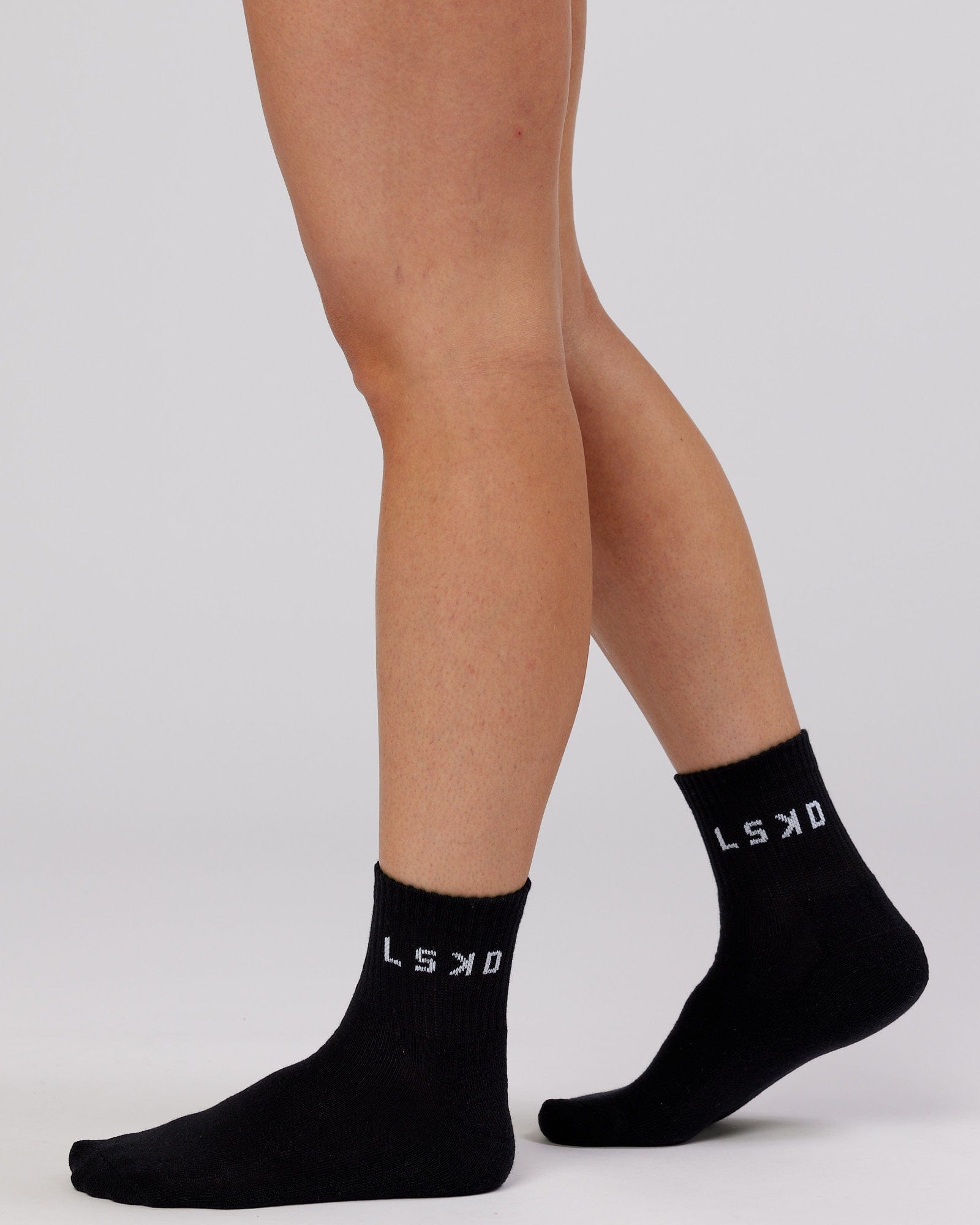 Model wearing Daily Quarter Crew Sock - Black