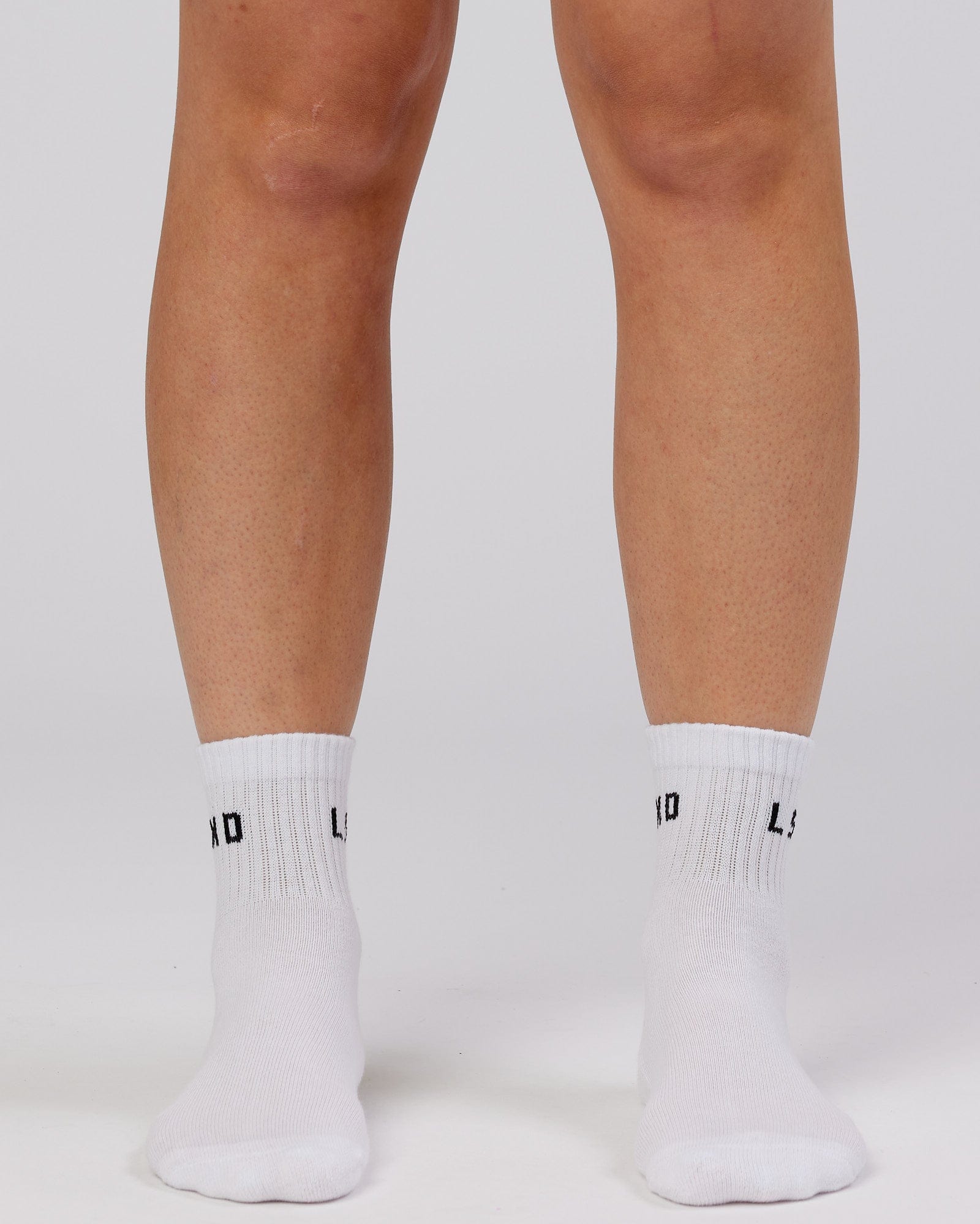 Model wearing Daily Quarter Crew Sock - White