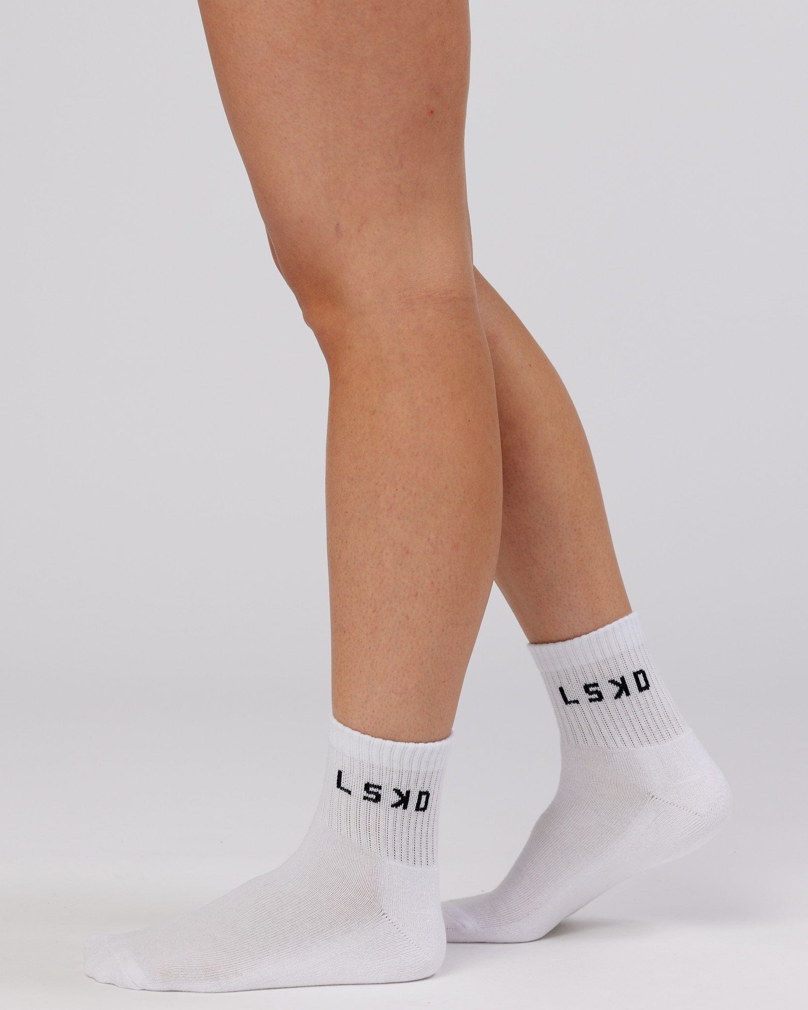 Model wearing Daily Quarter Crew Sock - White