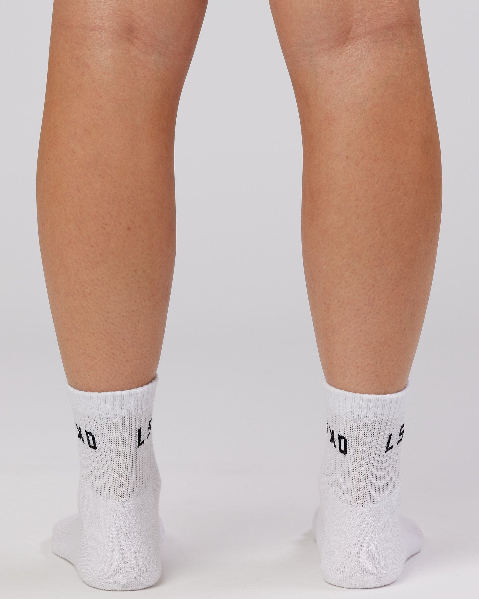 Model wearing Daily Quarter Crew Sock - White