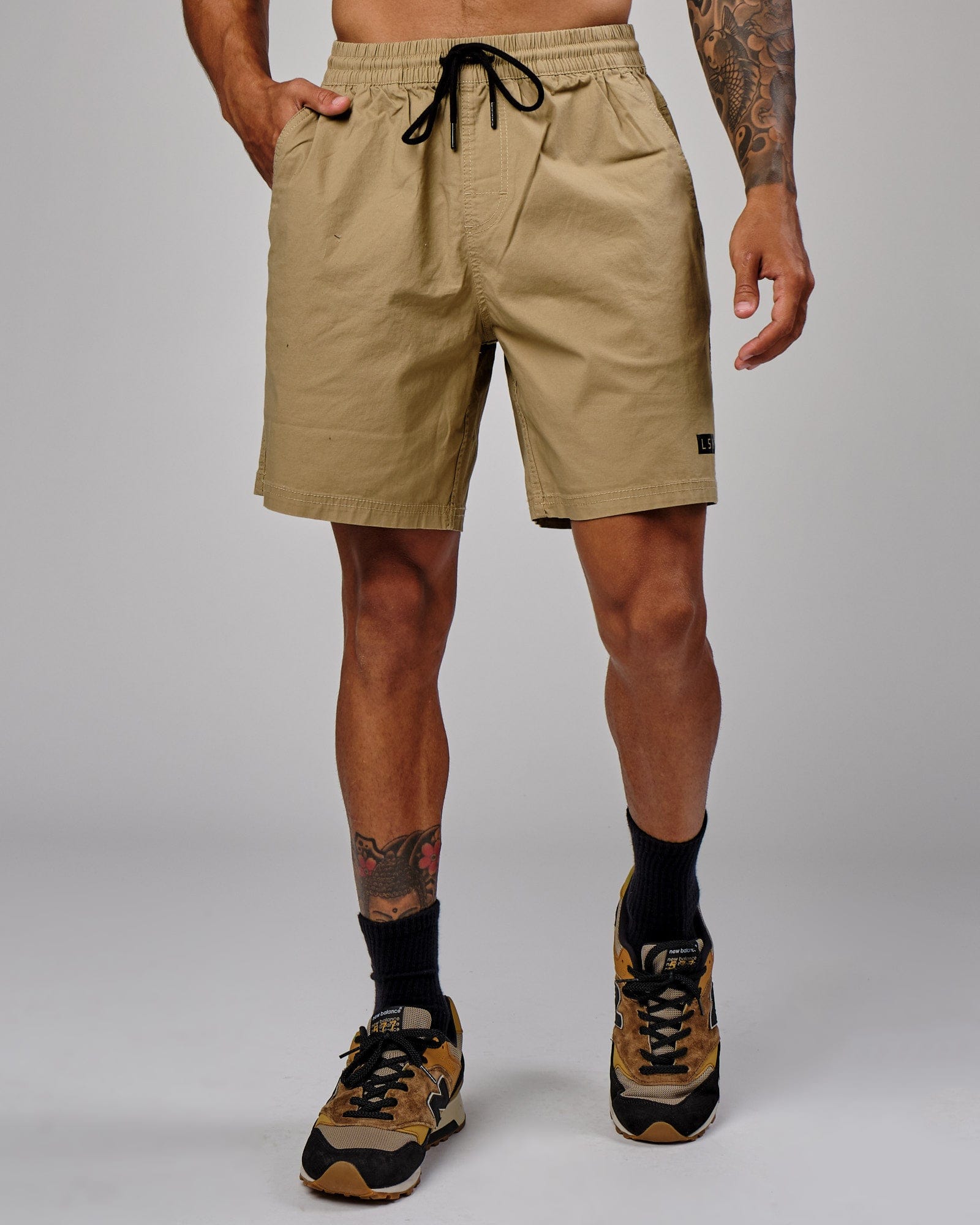 Model wearing Daily Short - Latte