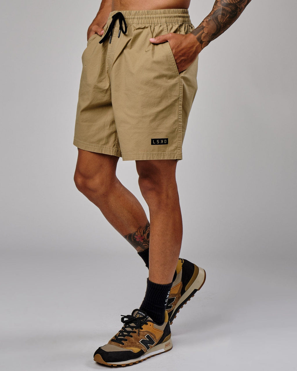 Model wearing Daily Short - Latte