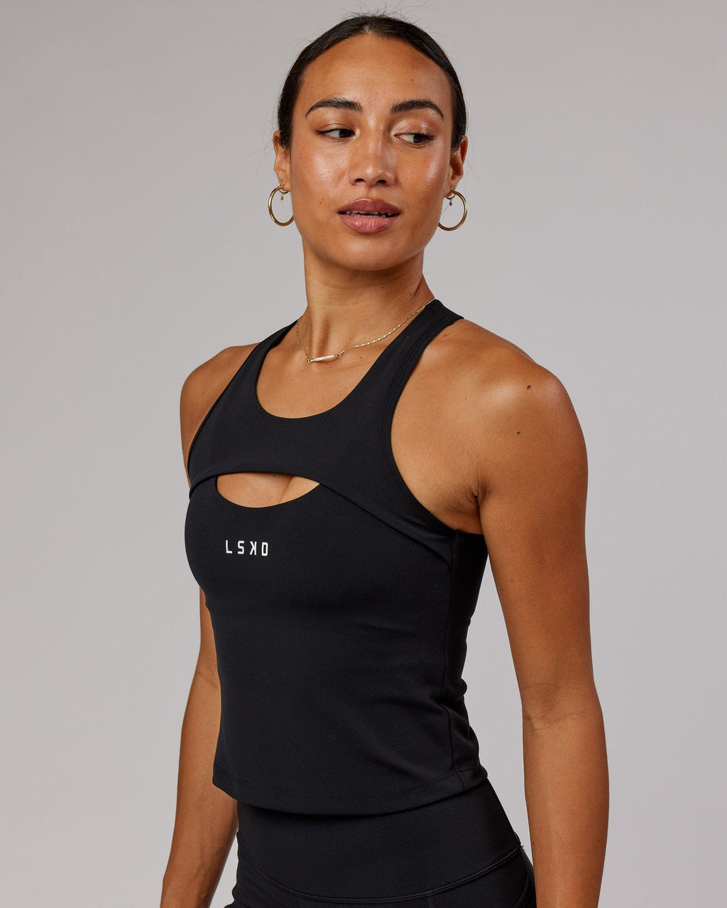 Model wearing Driven Shelf Bra Performance Tank - Black