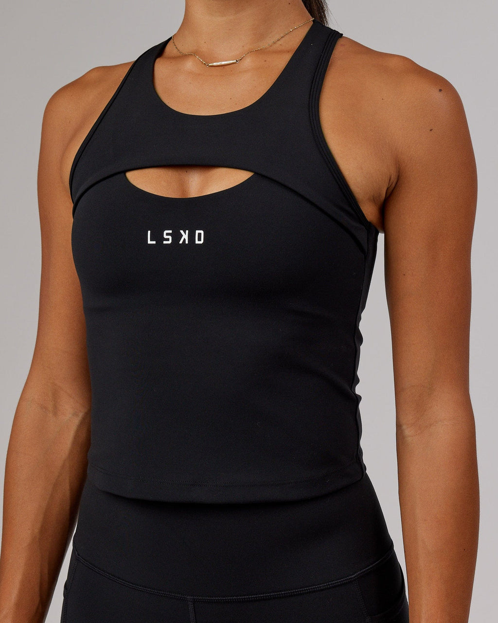 Model wearing Driven Shelf Bra Performance Tank - Black