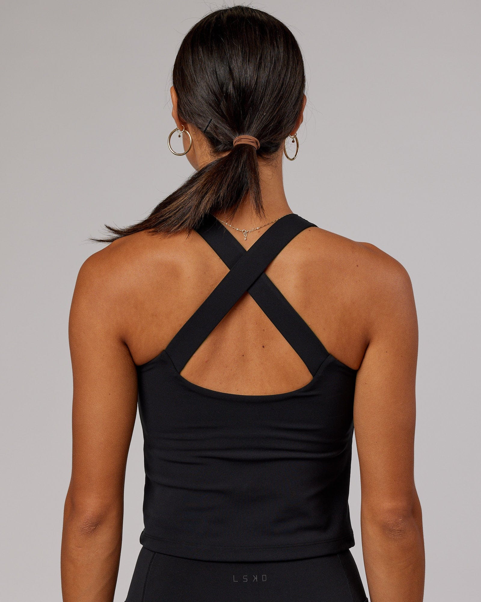 Model wearing Driven Shelf Bra Performance Tank - Black