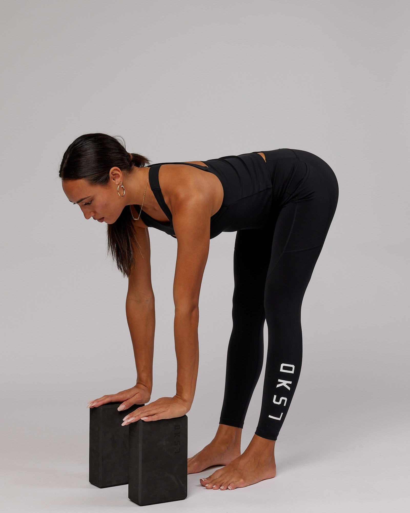 Model wearing Driven Shelf Bra Performance Tank - Black