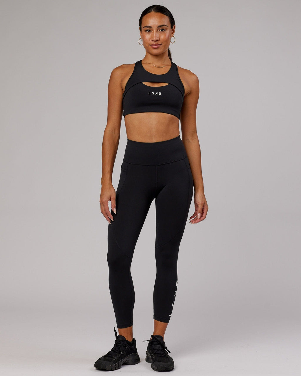 Model wearing Driven Sports Bra - Black
