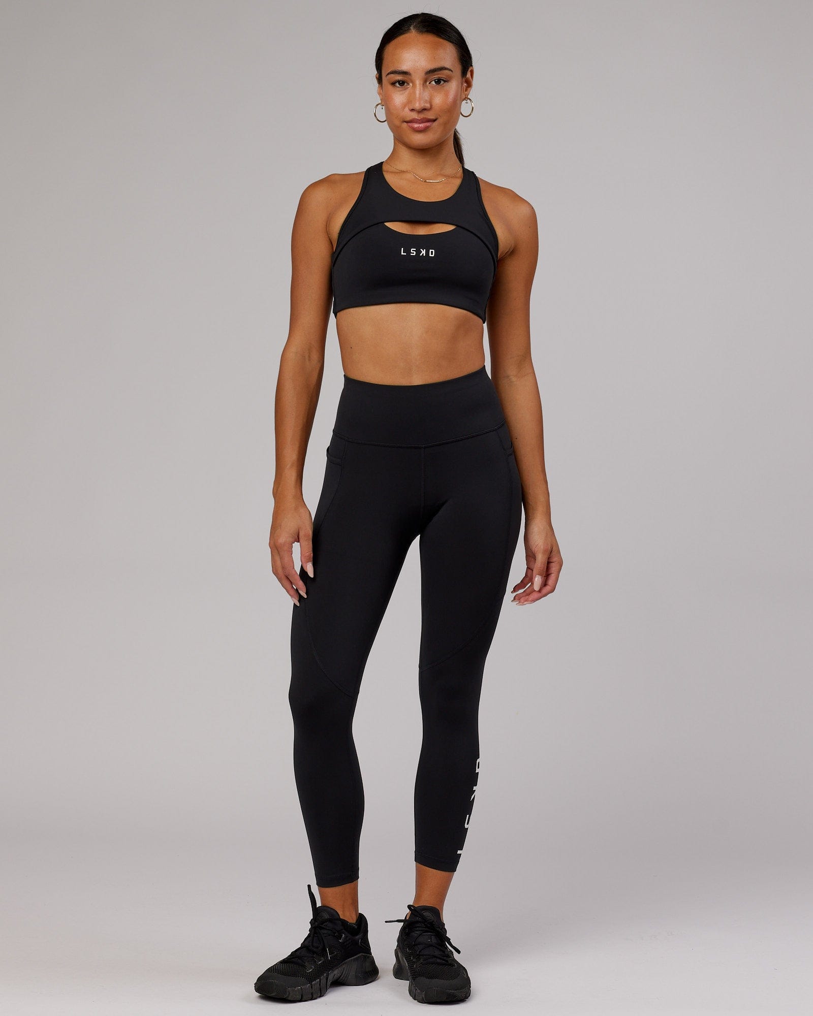 Model wearing Driven Sports Bra - Black