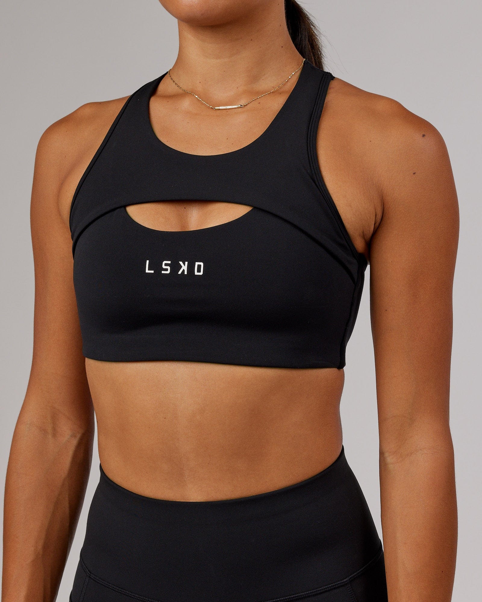 Model wearing Driven Sports Bra - Black