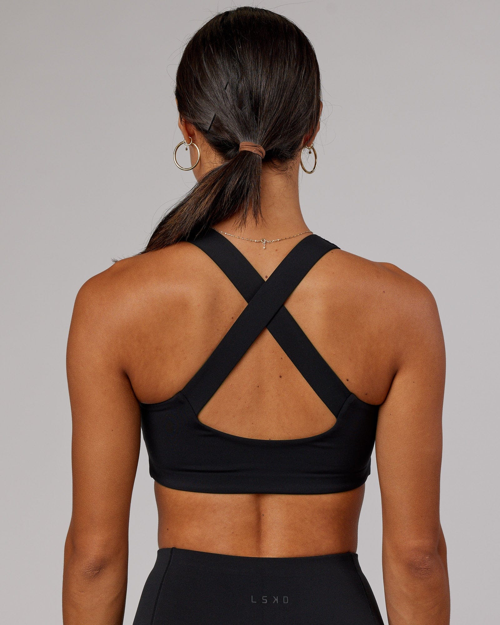 Model wearing Driven Sports Bra - Black