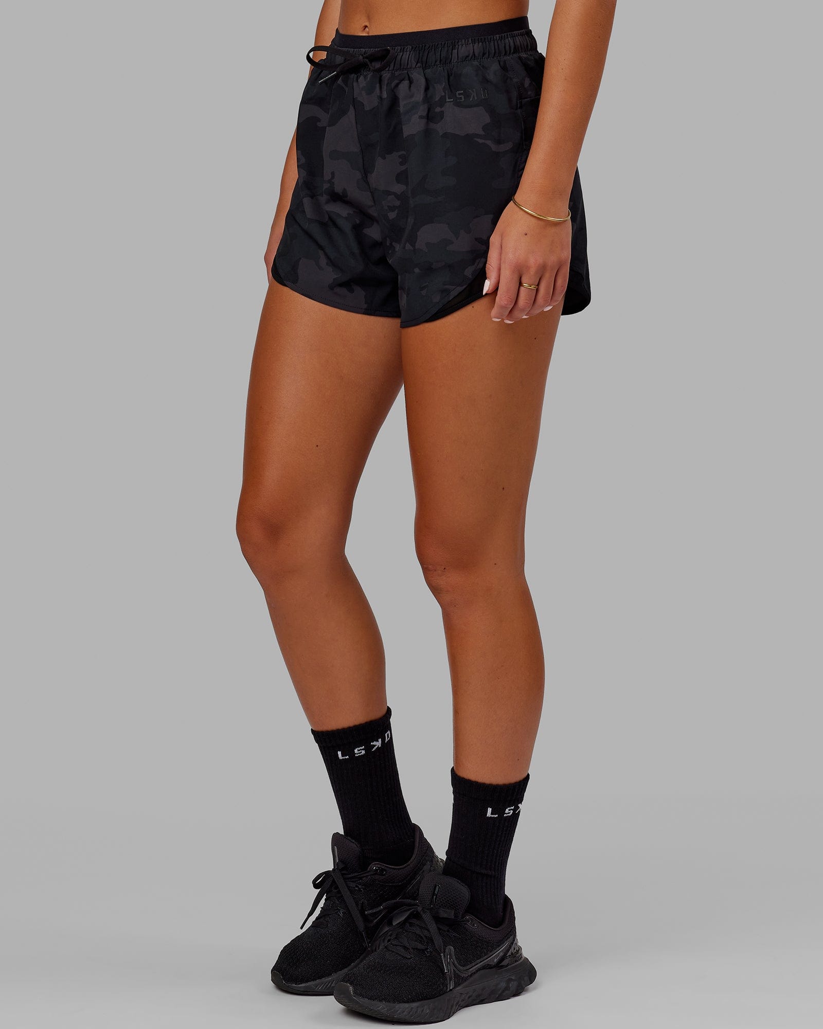 Model wearing Dynamic Run Short - Black Camo