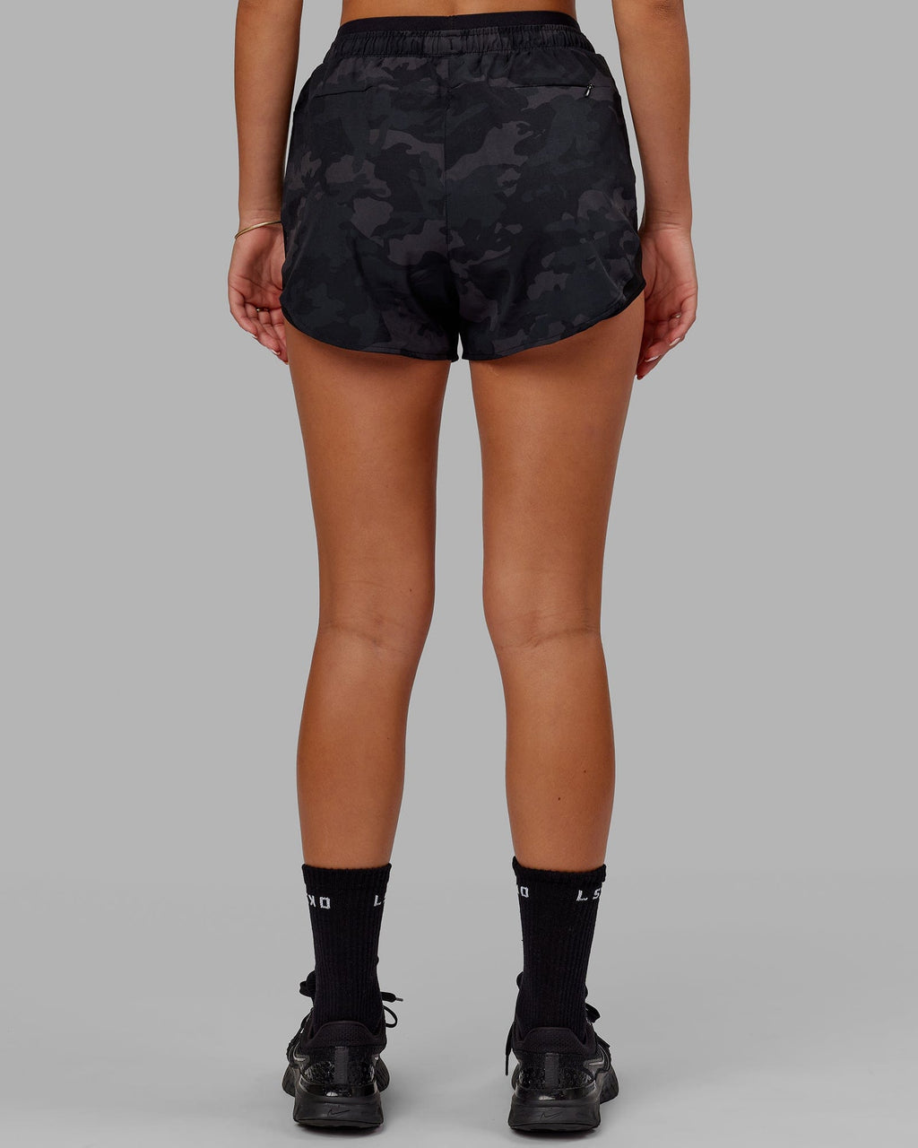Model wearing Dynamic Run Short - Black Camo