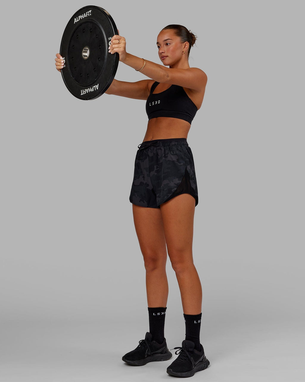 Model wearing Dynamic Run Short - Black Camo