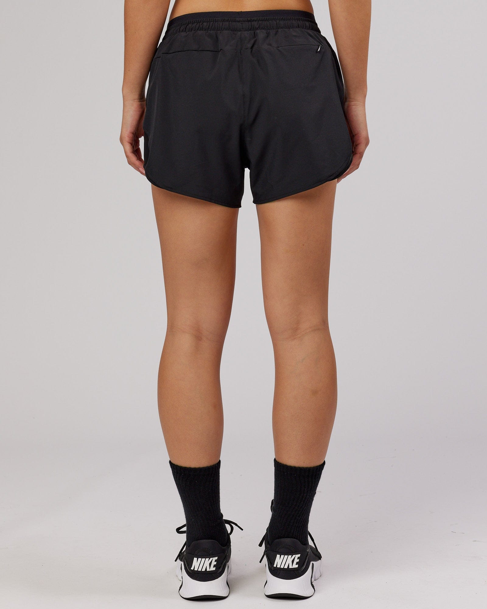 Model wearing Dynamic Run Short - Black-Flamingo