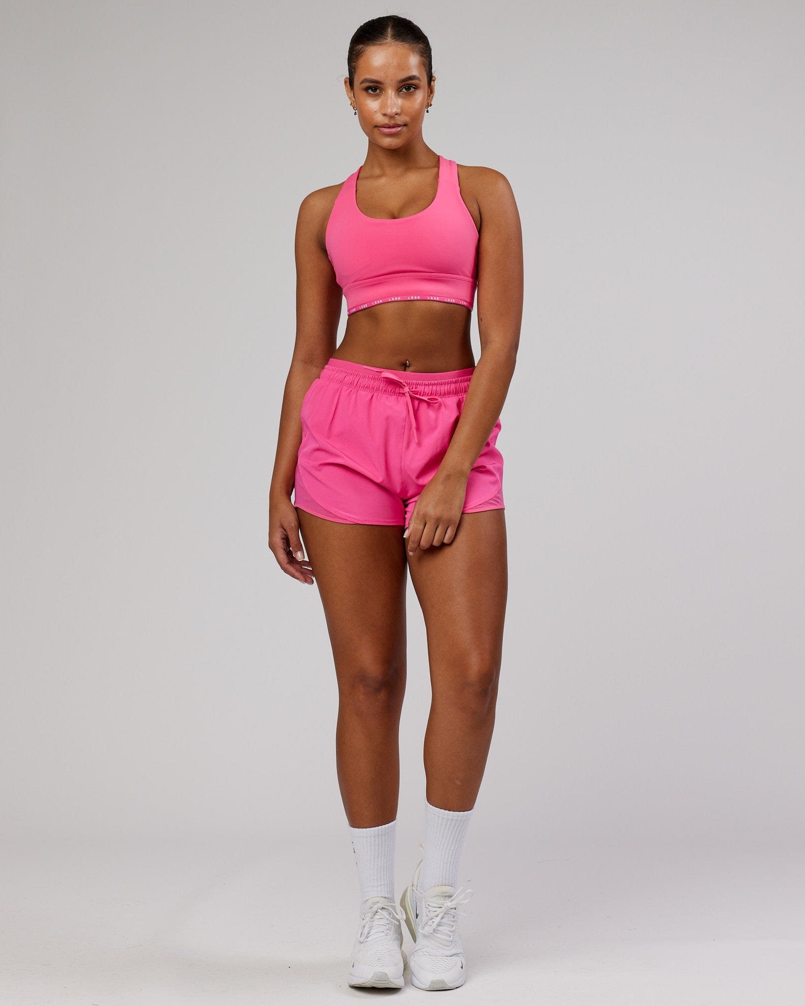 Model wearing Dynamic Run Short - Flamingo