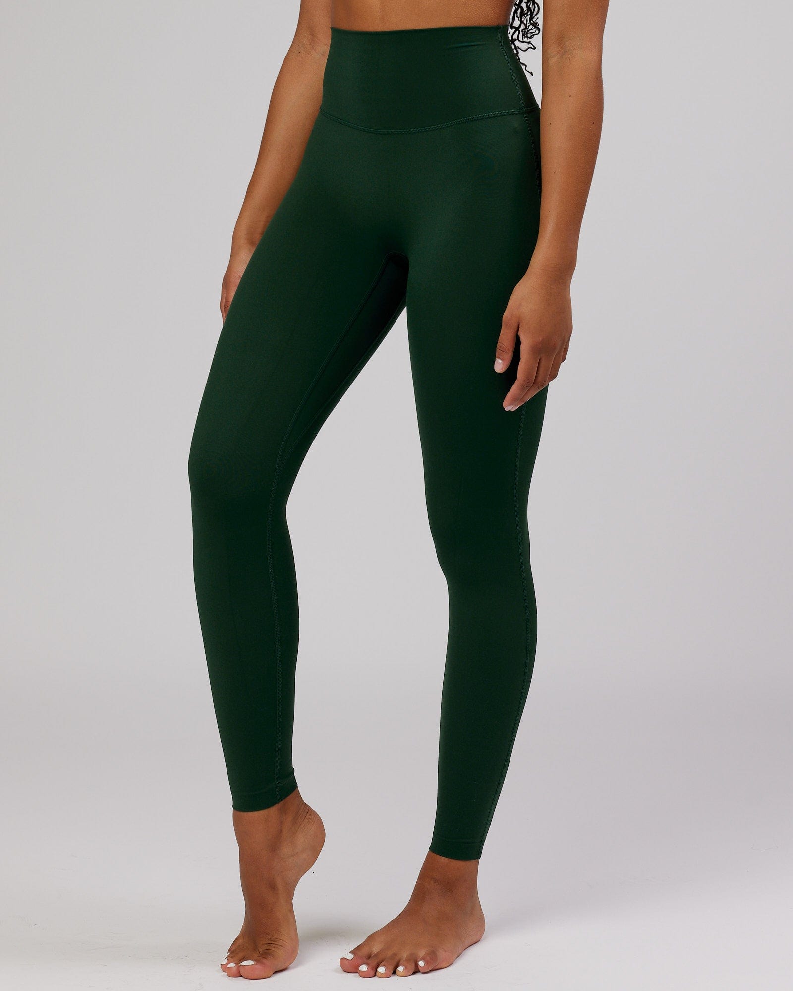 Model wearing Elixir Full Length Tight - Ivy Green
