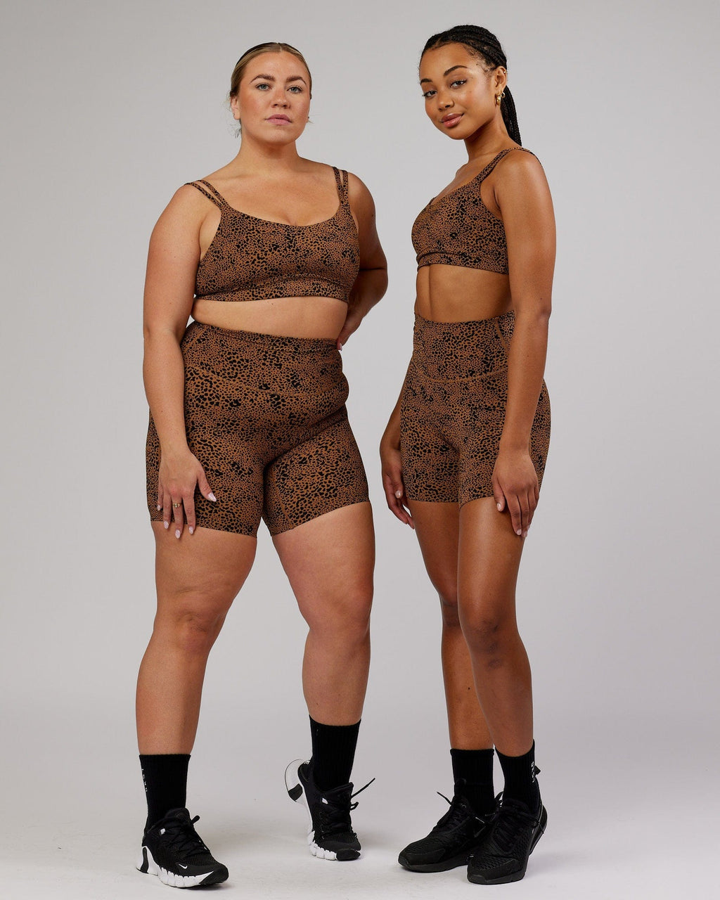 Model wearing Elixir Mid Short Tight - Agile Camel Print