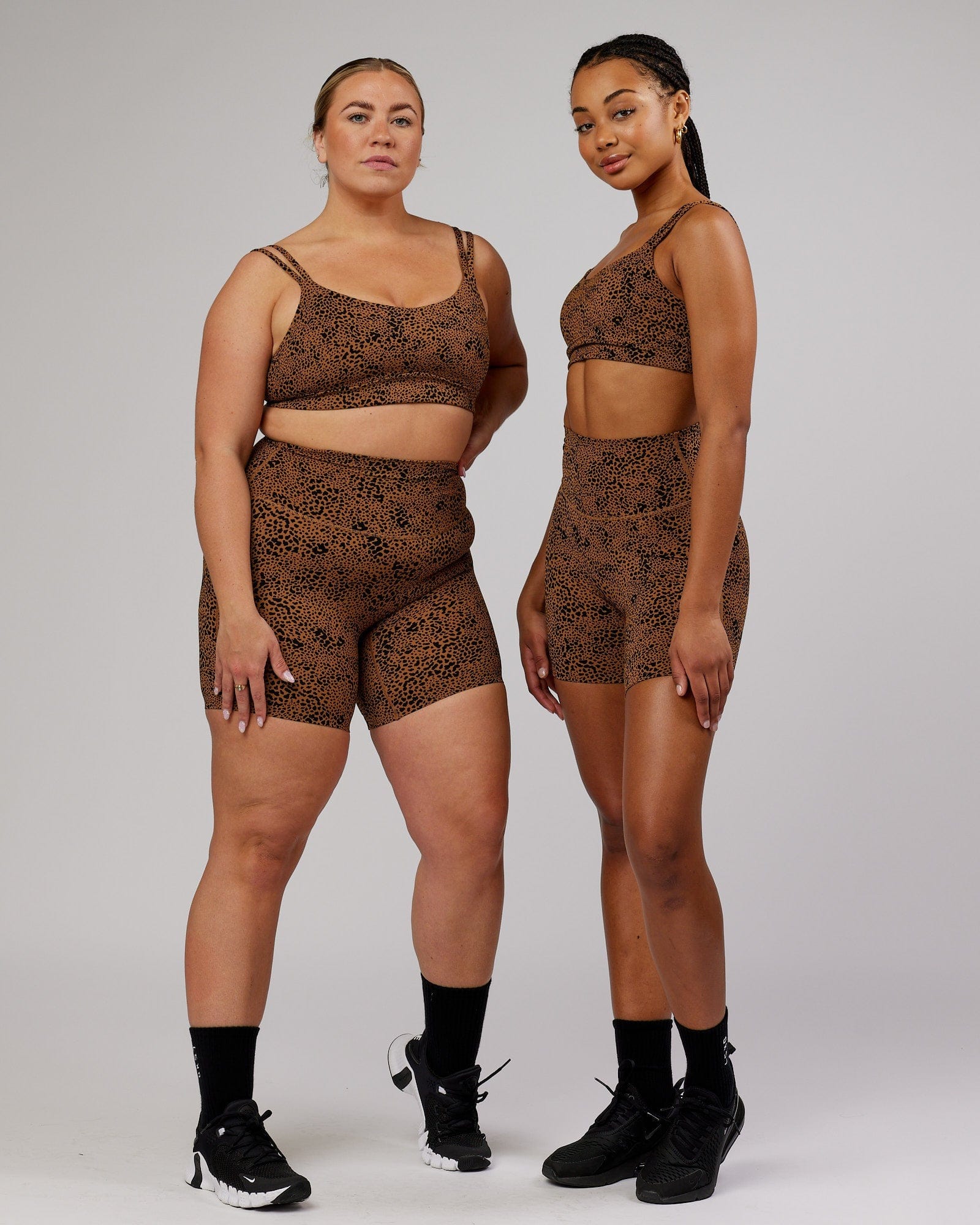 Model wearing Elixir Mid Short Tight - Agile Camel Print