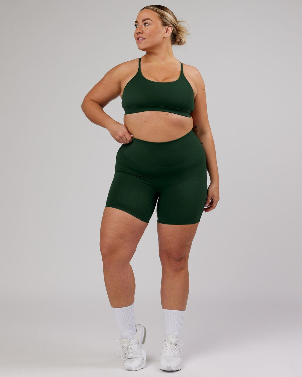 Model wearing Elixir Mid Short Tight - Ivy Green