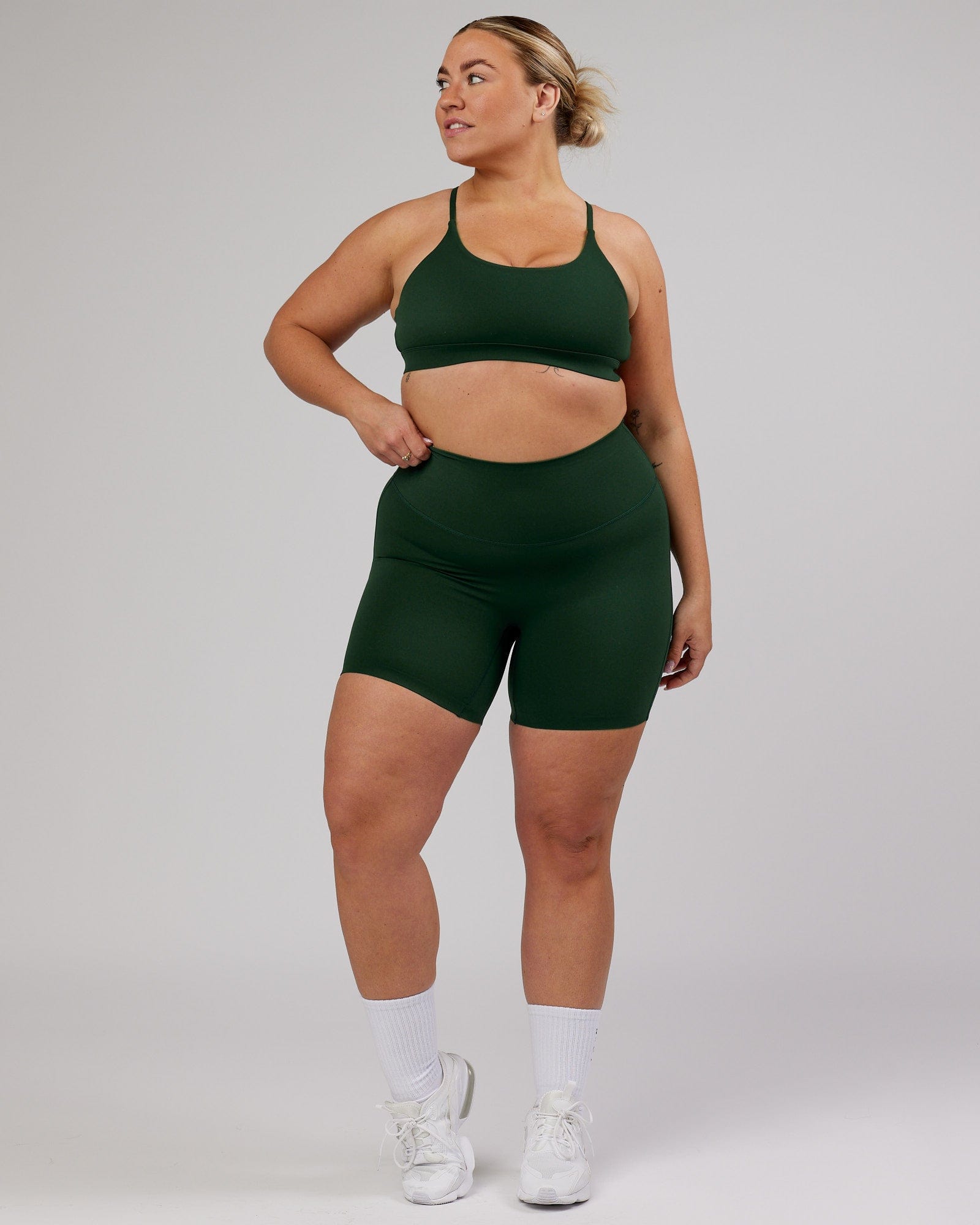 Model wearing Elixir Mid Short Tight - Ivy Green
