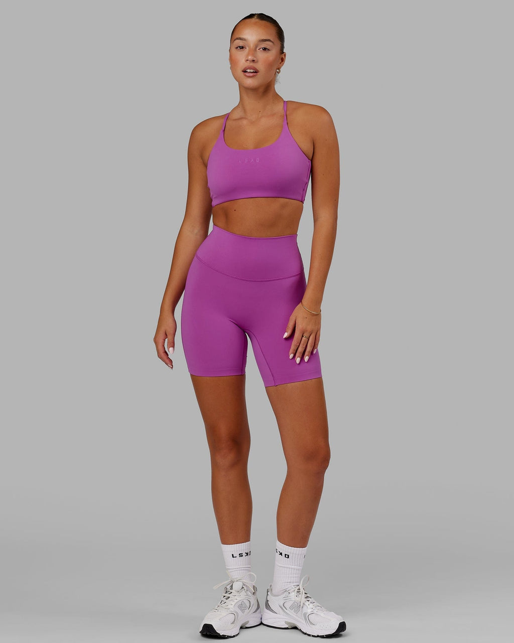Model wearing Elixir Mid Short Tight - Orchid