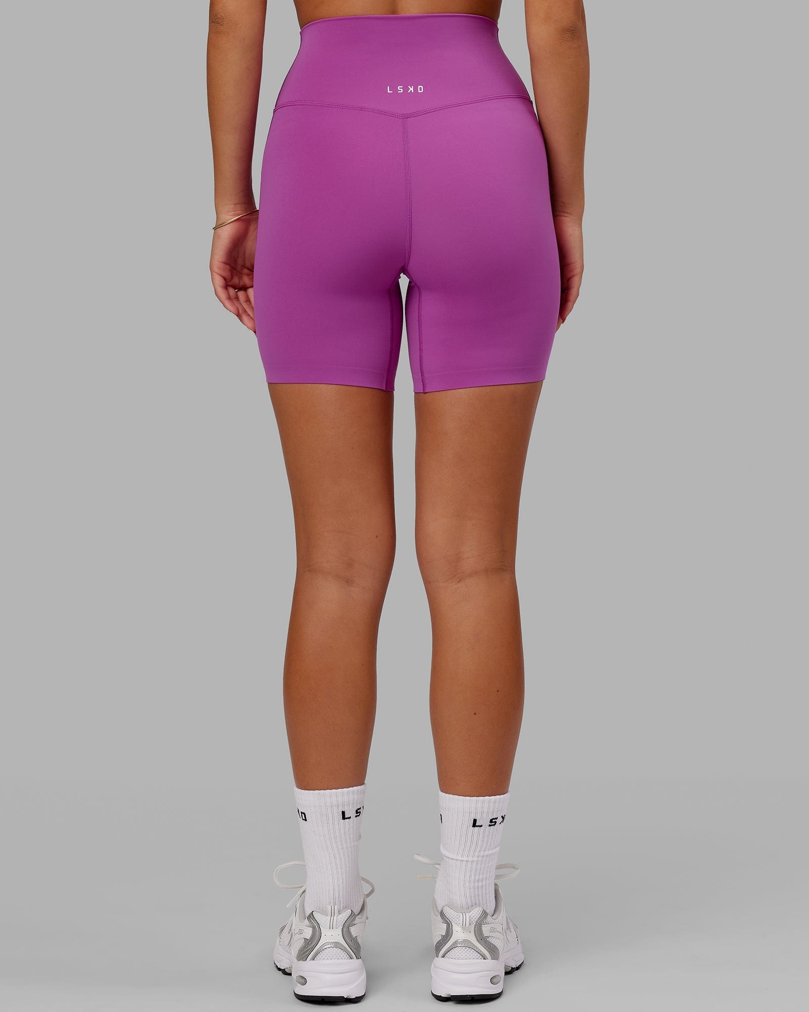 Model wearing Elixir Mid Short Tight - Orchid