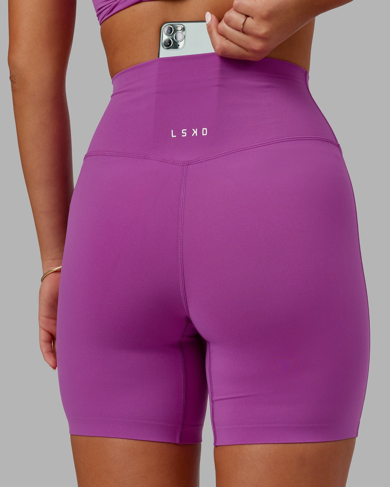 Model wearing Elixir Mid Short Tight - Orchid