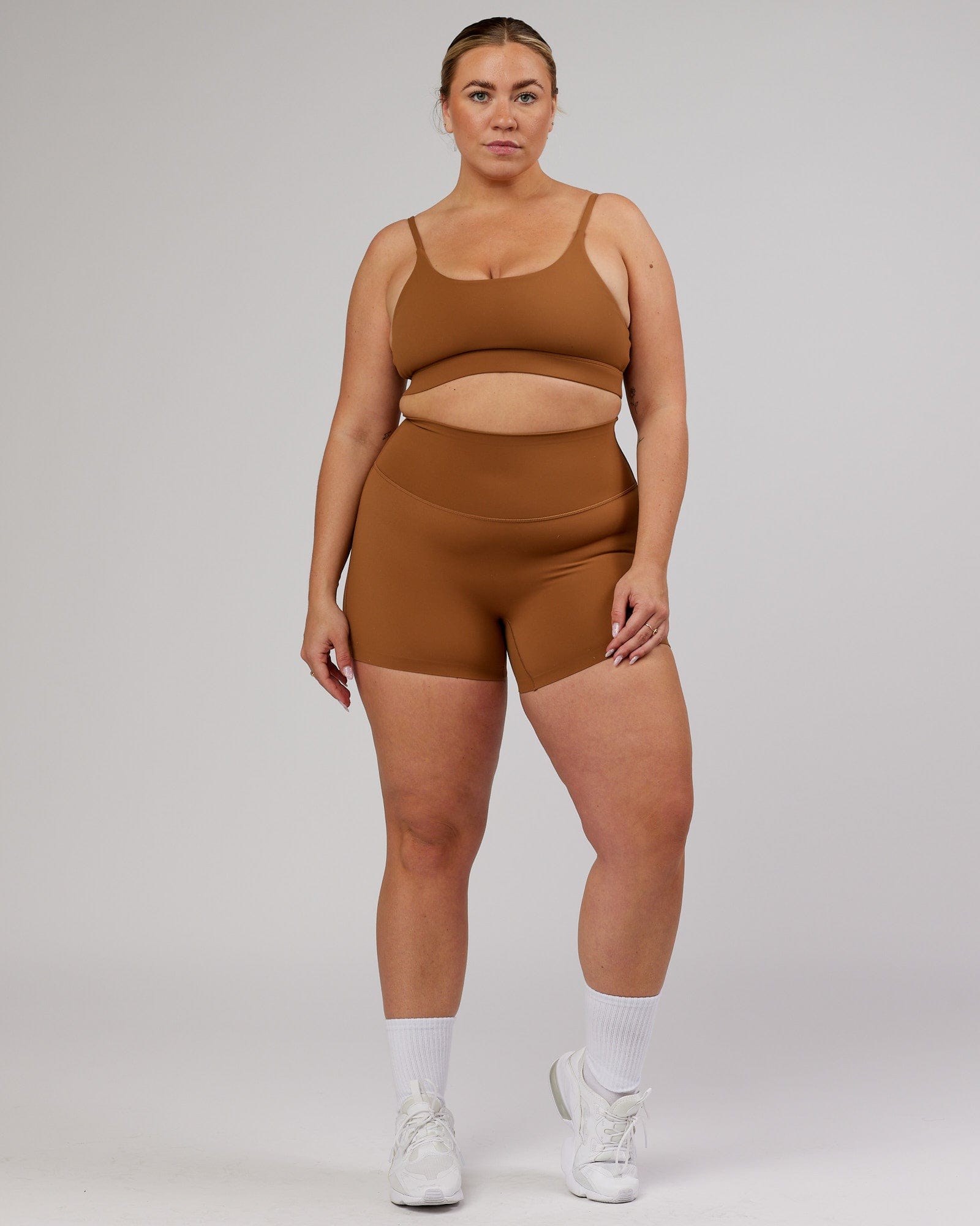 Model wearing Elixir Sports Bra - Camel