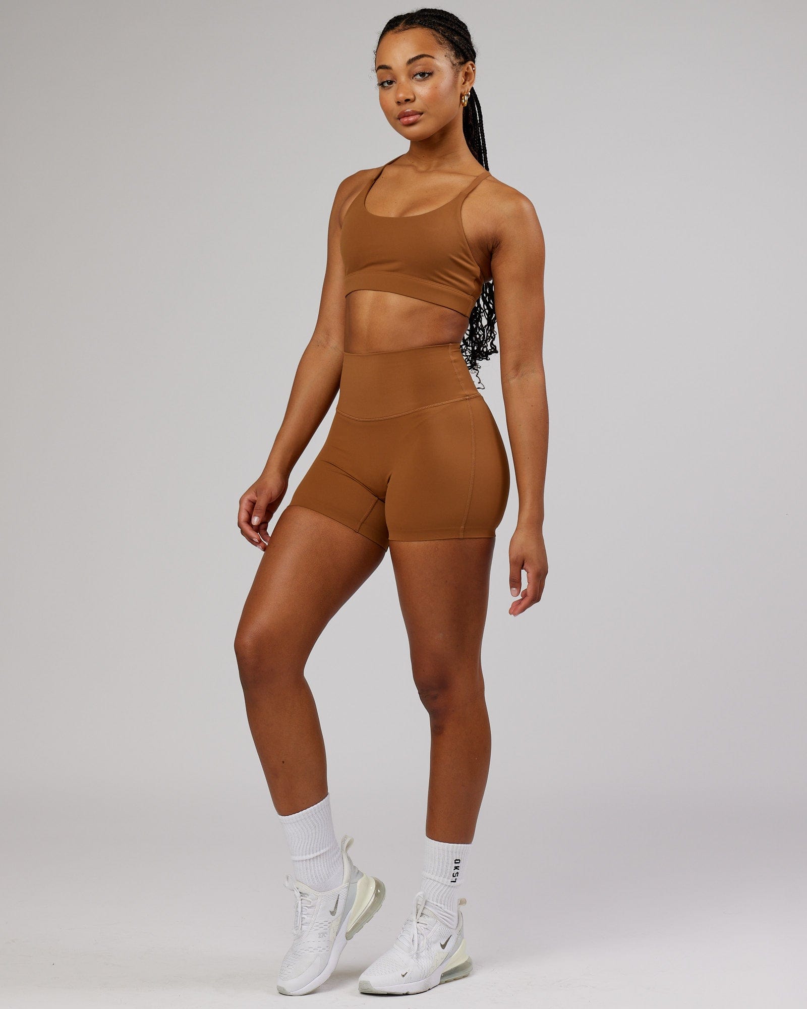 Model wearing Elixir Sports Bra - Camel