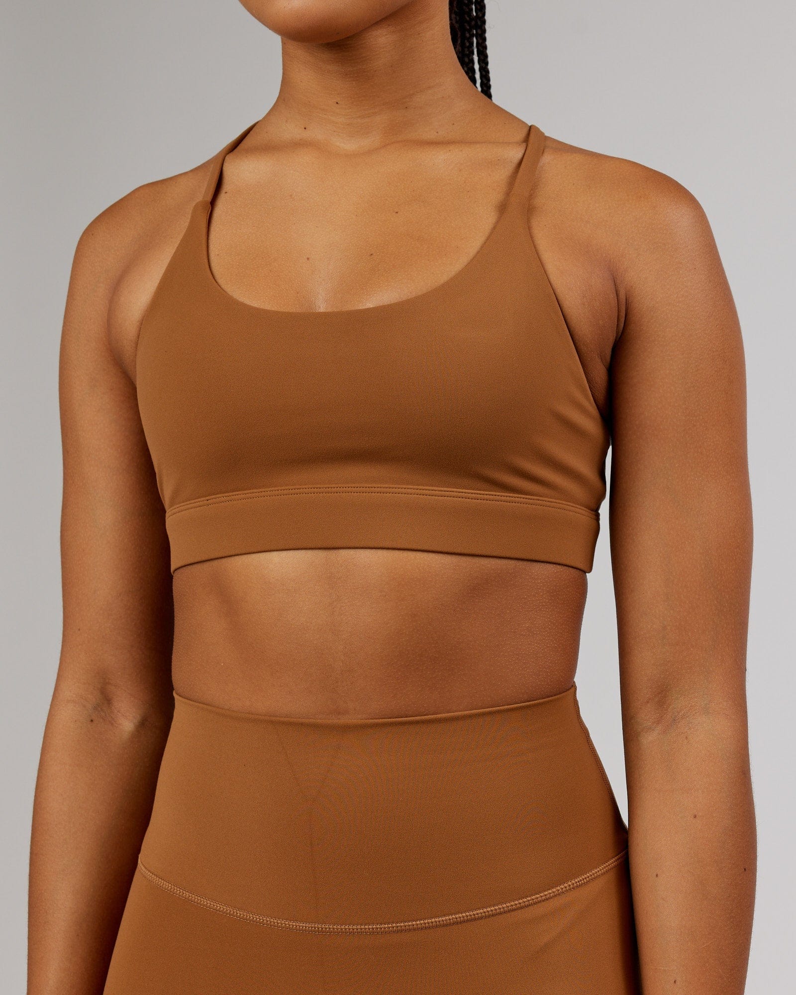 Model wearing Elixir Sports Bra - Camel