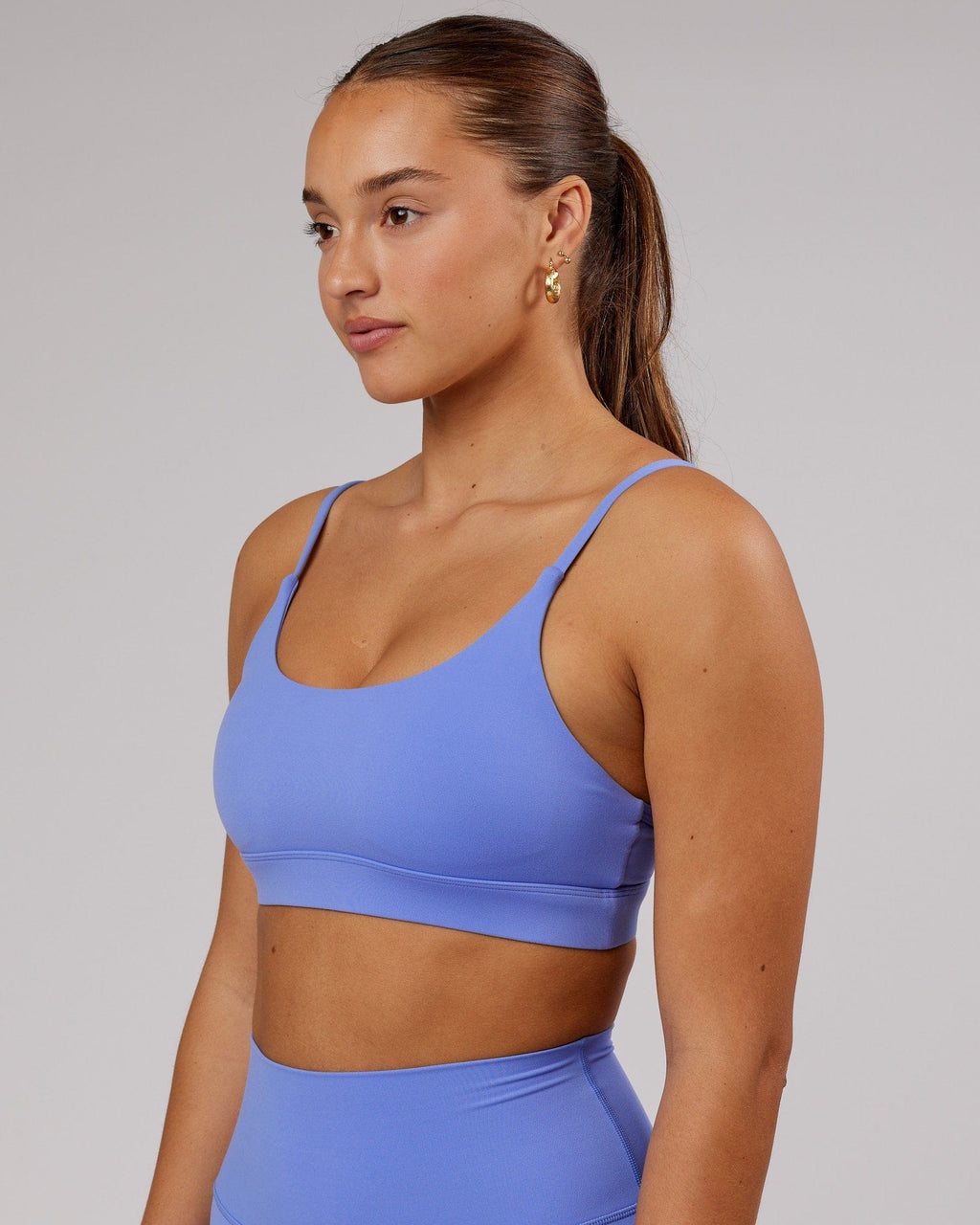 Model wearing Elixir Sports Bra - Indulgent Blue