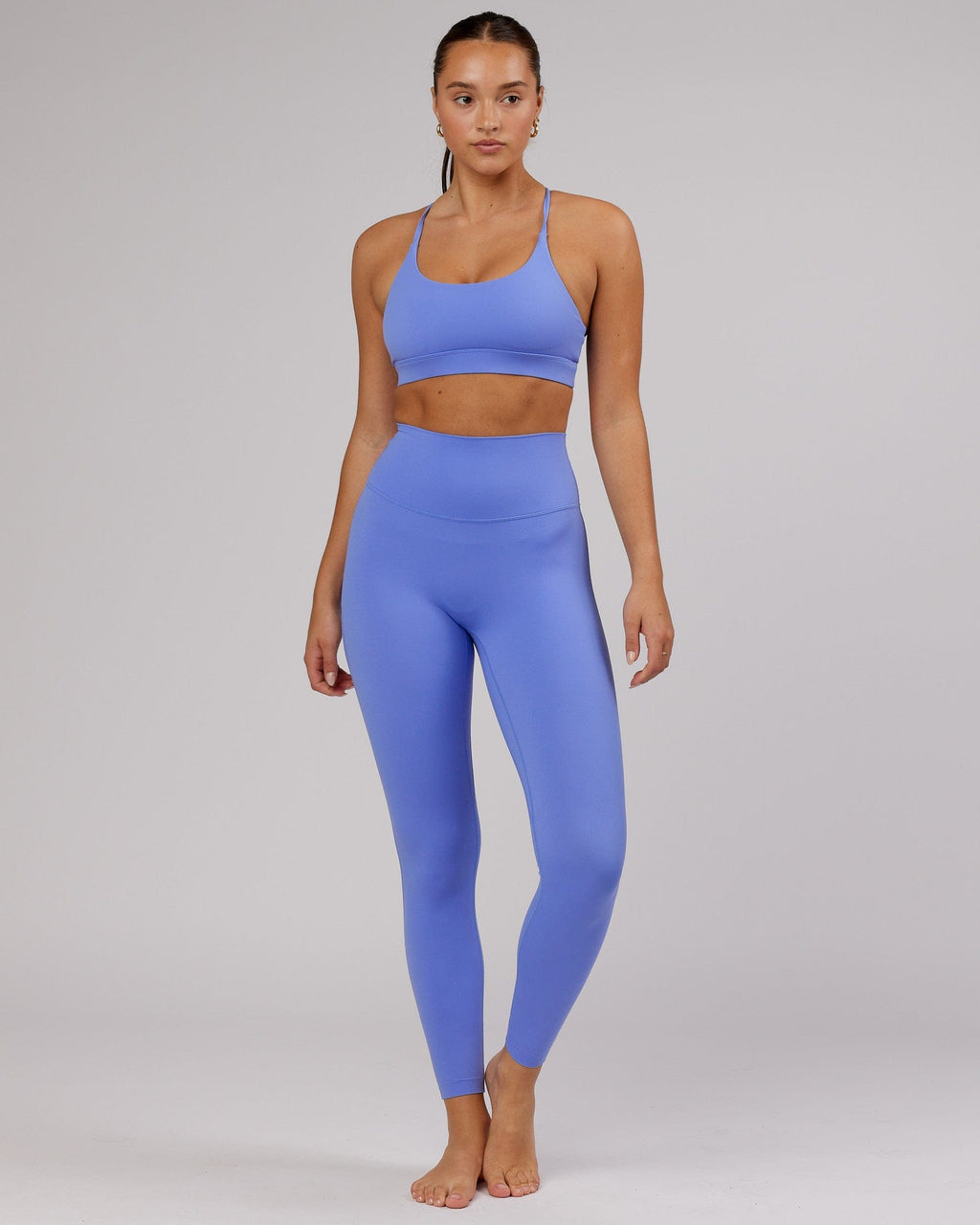 Model wearing Elixir Sports Bra - Indulgent Blue