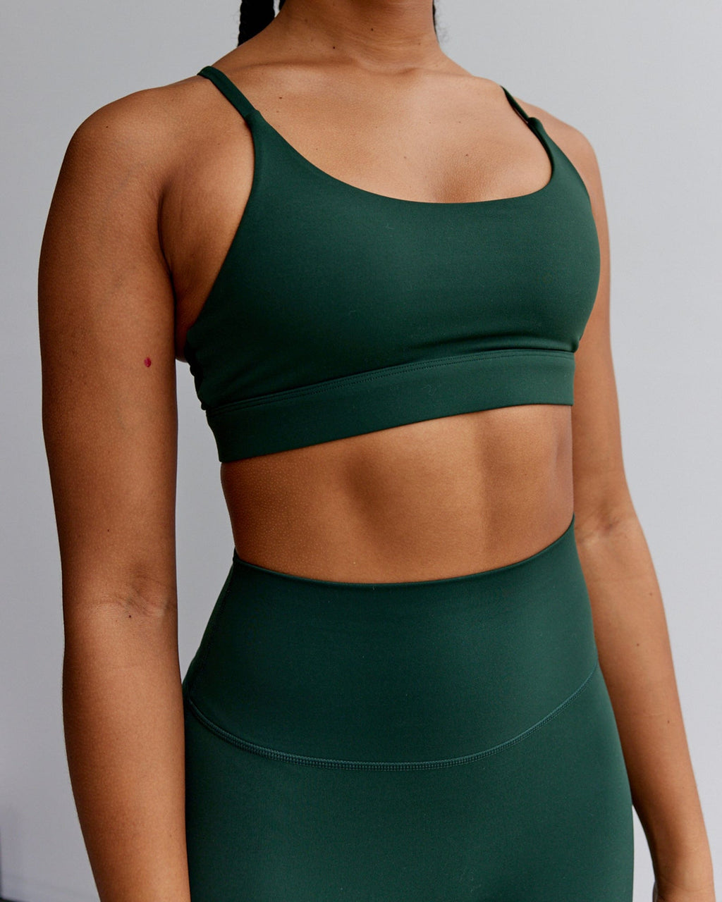 Model wearing Elixir Sports Bra - Ivy Green
