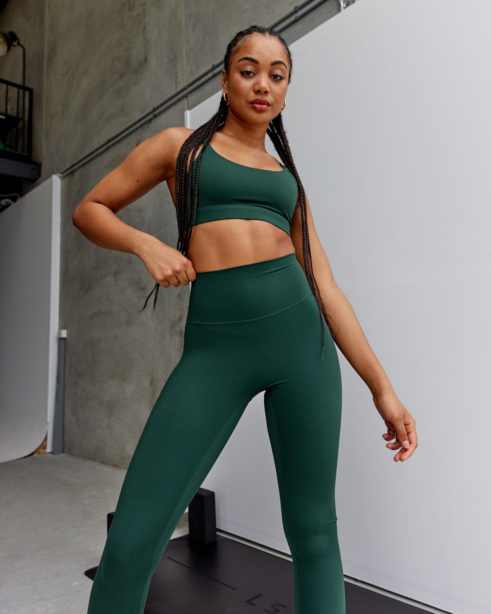Model wearing Elixir Sports Bra - Ivy Green