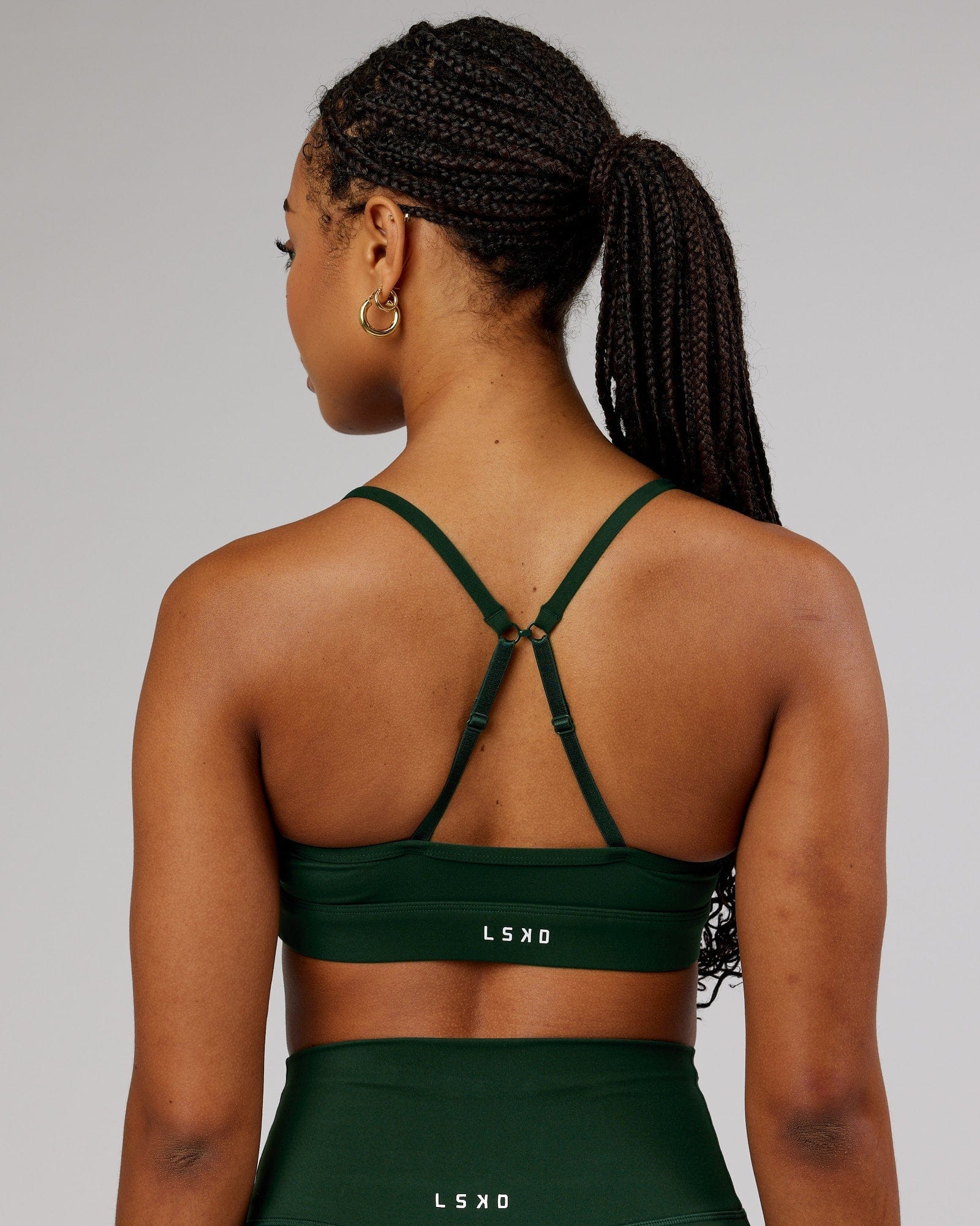 Model wearing Elixir Sports Bra - Ivy Green
