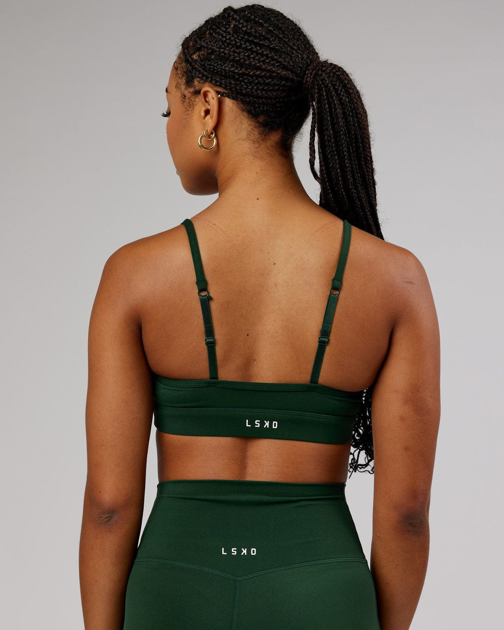 Model wearing Elixir Sports Bra - Ivy Green