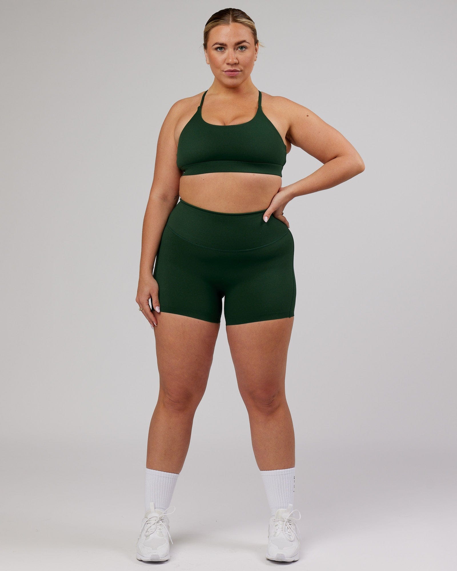 Model wearing Elixir Sports Bra - Ivy Green