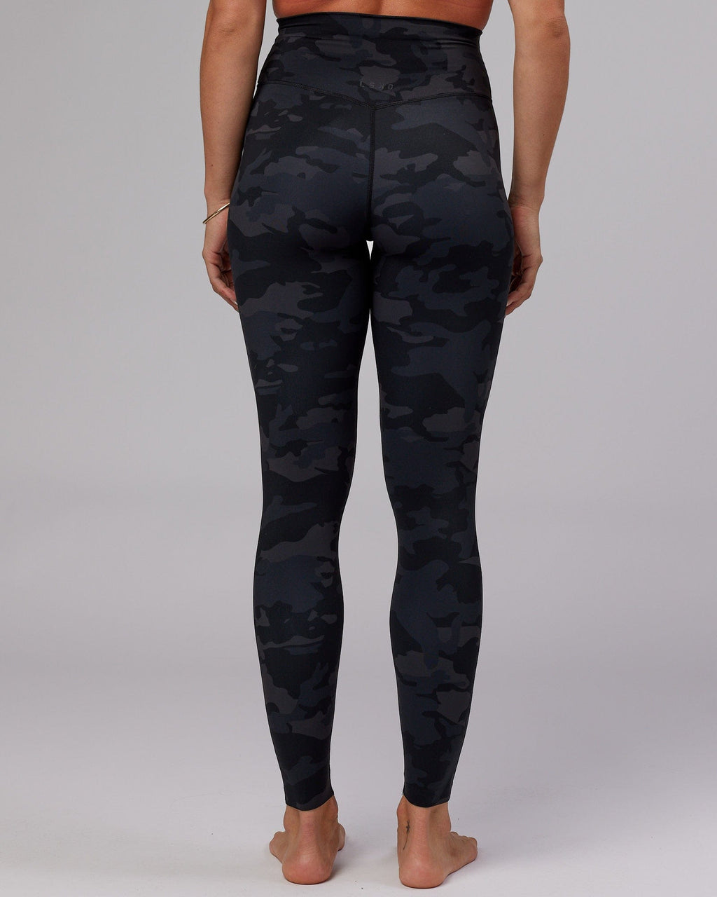 Model wearing Elixir X-Long Tight - Black Camo