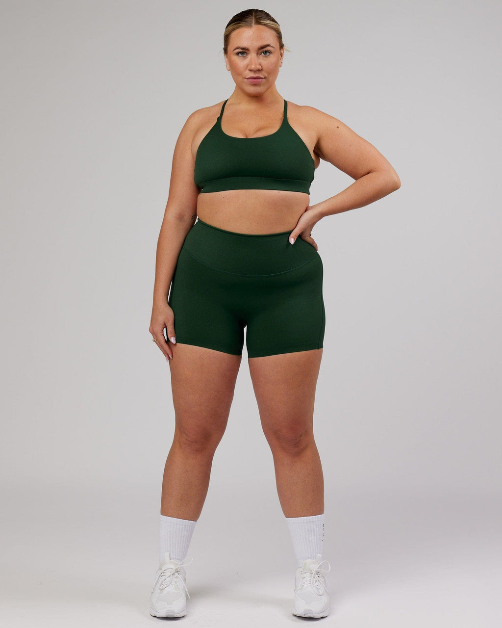 Model wearing Elixir X-Short Tight - Ivy Green
