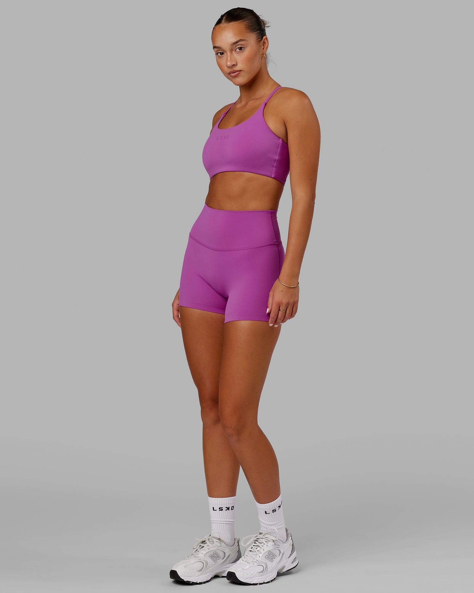 Model wearing Elixir X-Short Tight - Orchid