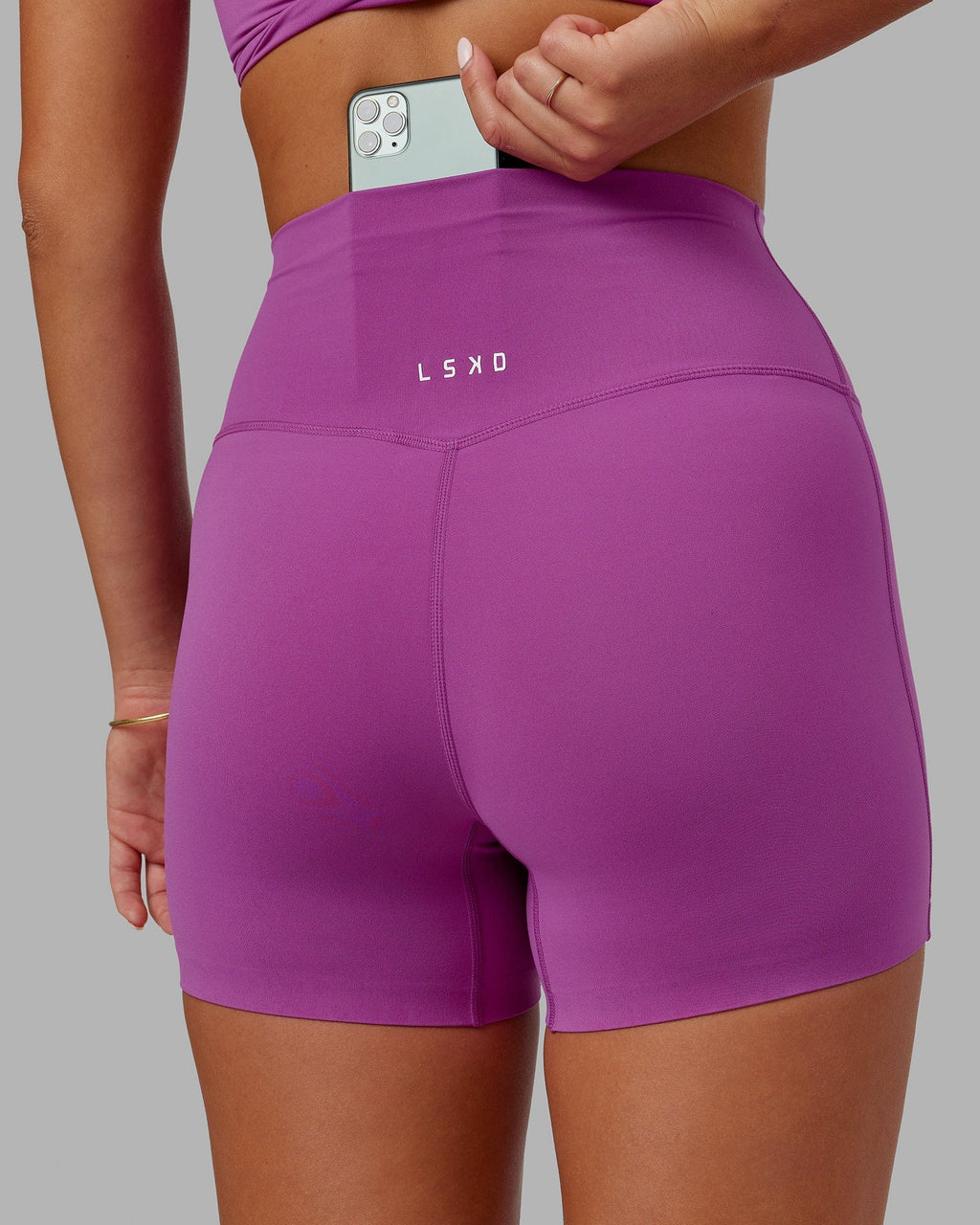 Model wearing Elixir X-Short Tight - Orchid