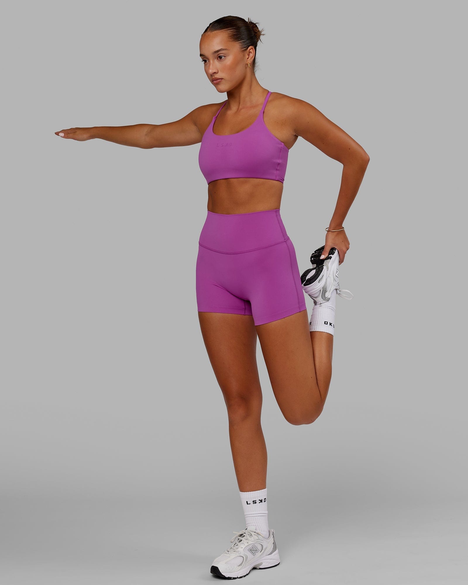 Model wearing Elixir X-Short Tight - Orchid