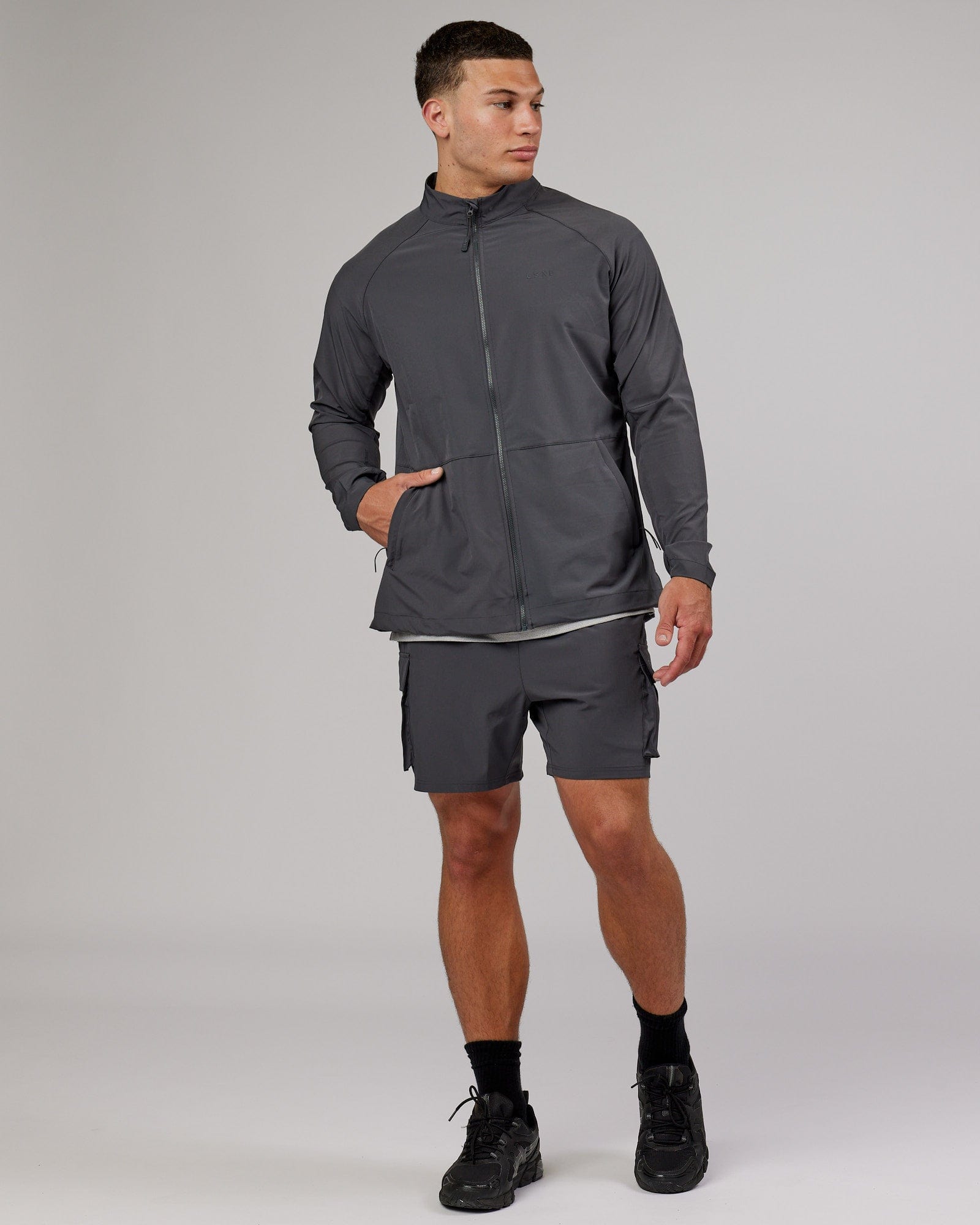 Model wearing Energy Stretch Performance Jacket - Asphalt