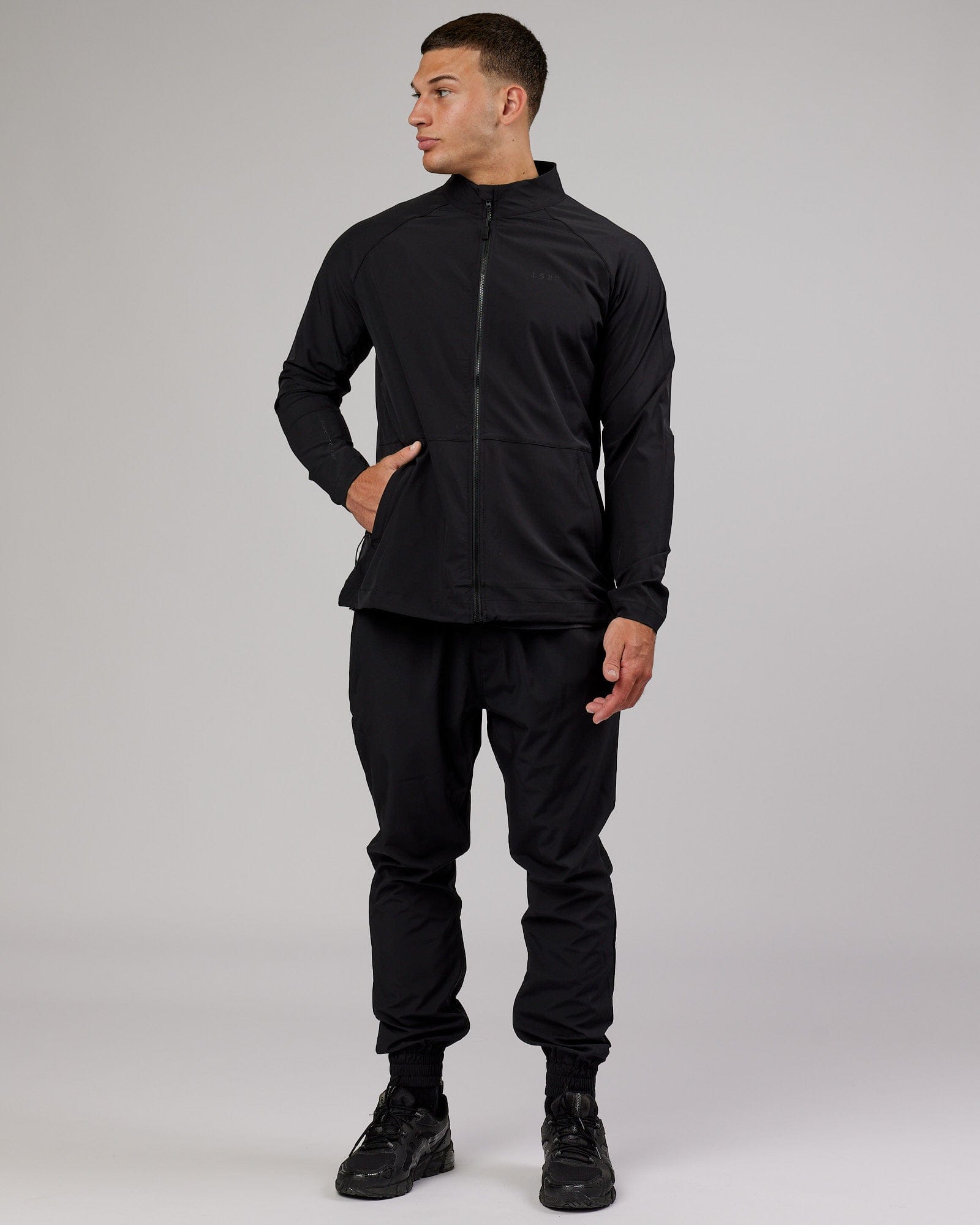 Model wearing Energy Stretch Performance Jacket - Black