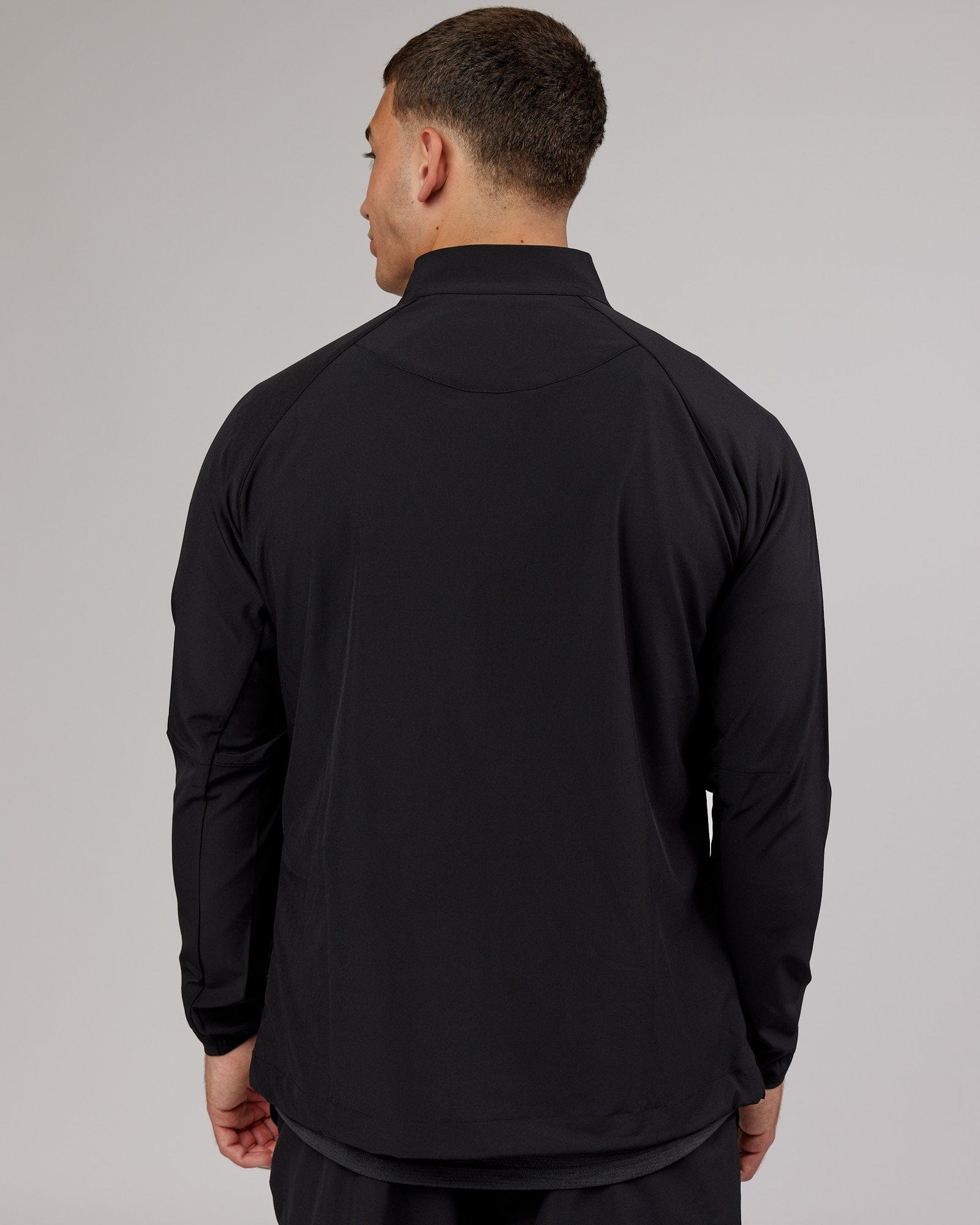 Model wearing Energy Stretch Performance Jacket - Black