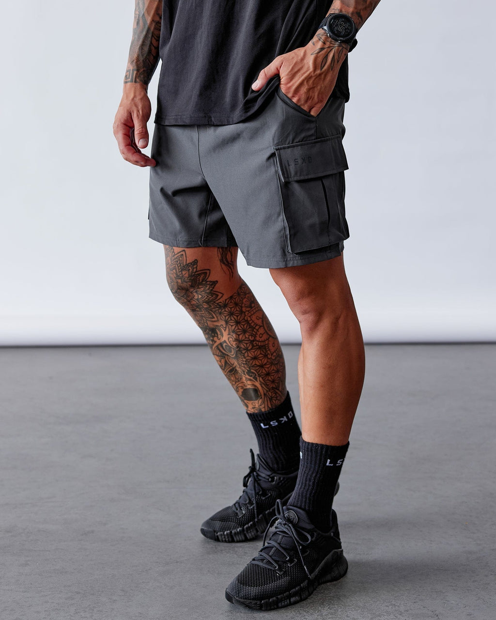 Model wearing Energy Stretch Performance Cargo Short - Asphalt