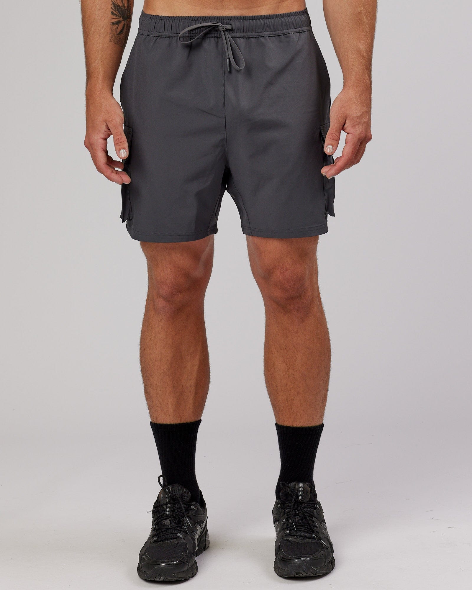 Model wearing Energy Stretch Performance Cargo Short - Asphalt